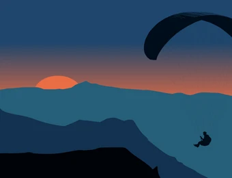 Sun on the horizon with orange glow, layered blue mountains, and a paraglider in the sky.